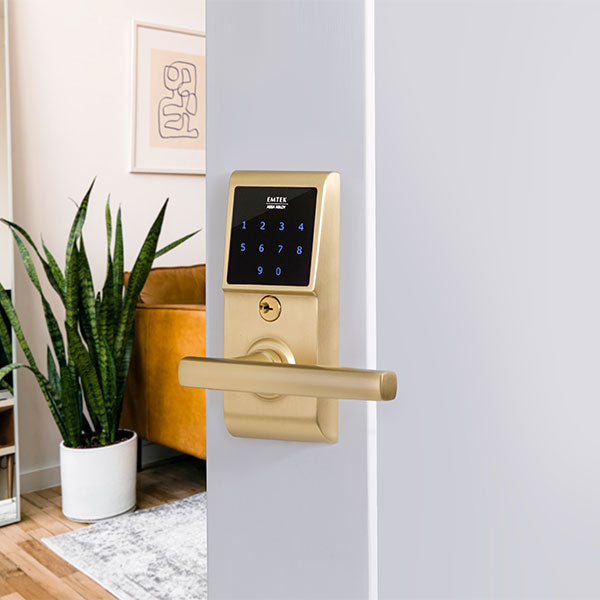 EMTouch™ Brass Keypad Leverset with Freestone lever installed in Satin Brass finish, passage/privacy function